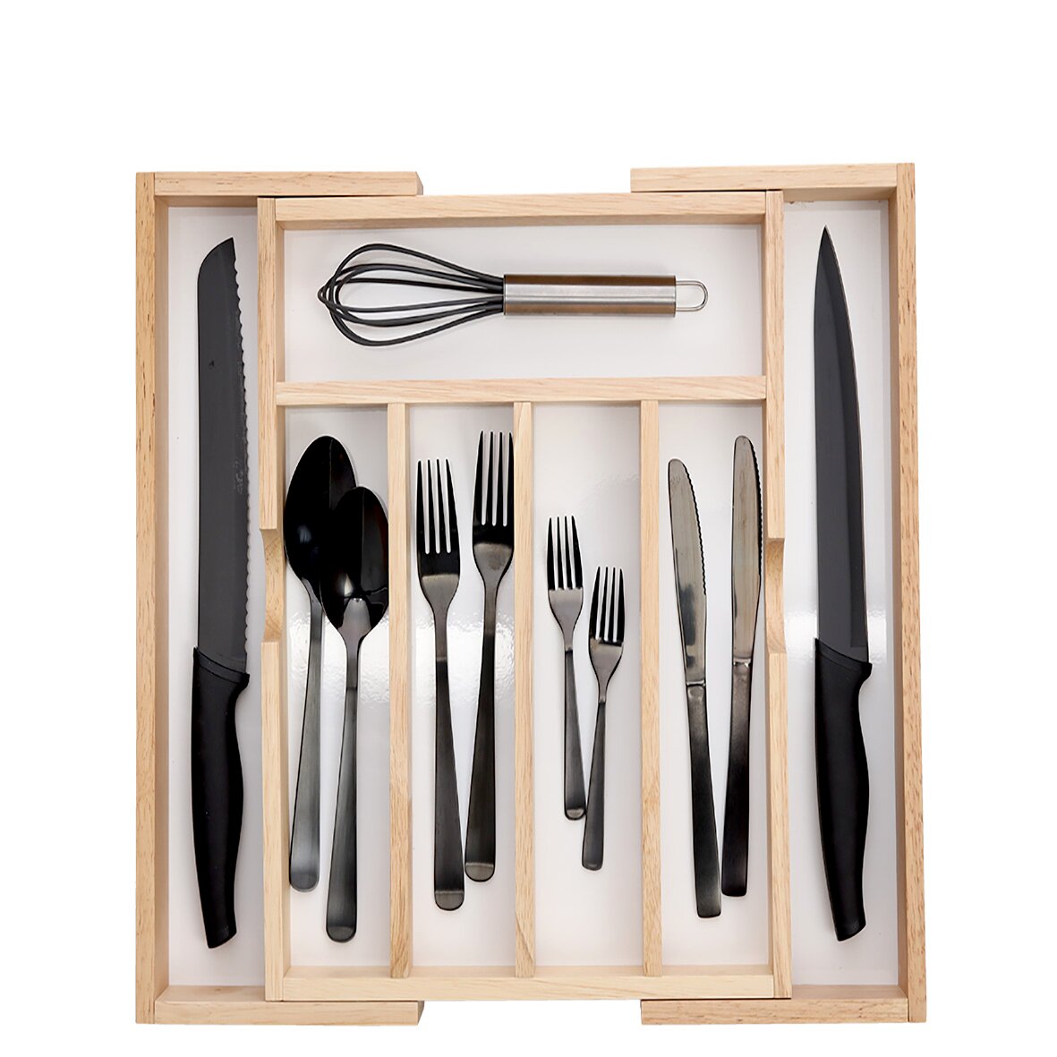 Vogelperspektive auf einen ausziehbaren Besteckkasten mit schwarzem Besteck und Küchenutensilien.