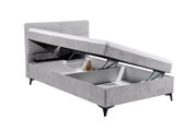 Graues Boxbett mit Stauraum, seitlich geöffnet, zeigt Innenraum und Hebemechanismus.
