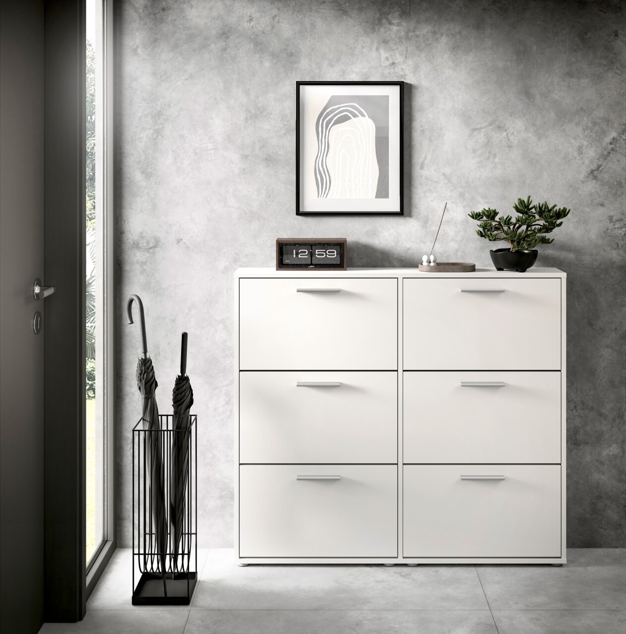 Moderner weißer Schuhkipper mit sechs Fächern, frontal fotografiert, in einem stilvollen Eingangsbereich mit grauer Wand, dekoriert mit einer Pflanze, einer Uhr und einem Kunstwerk.