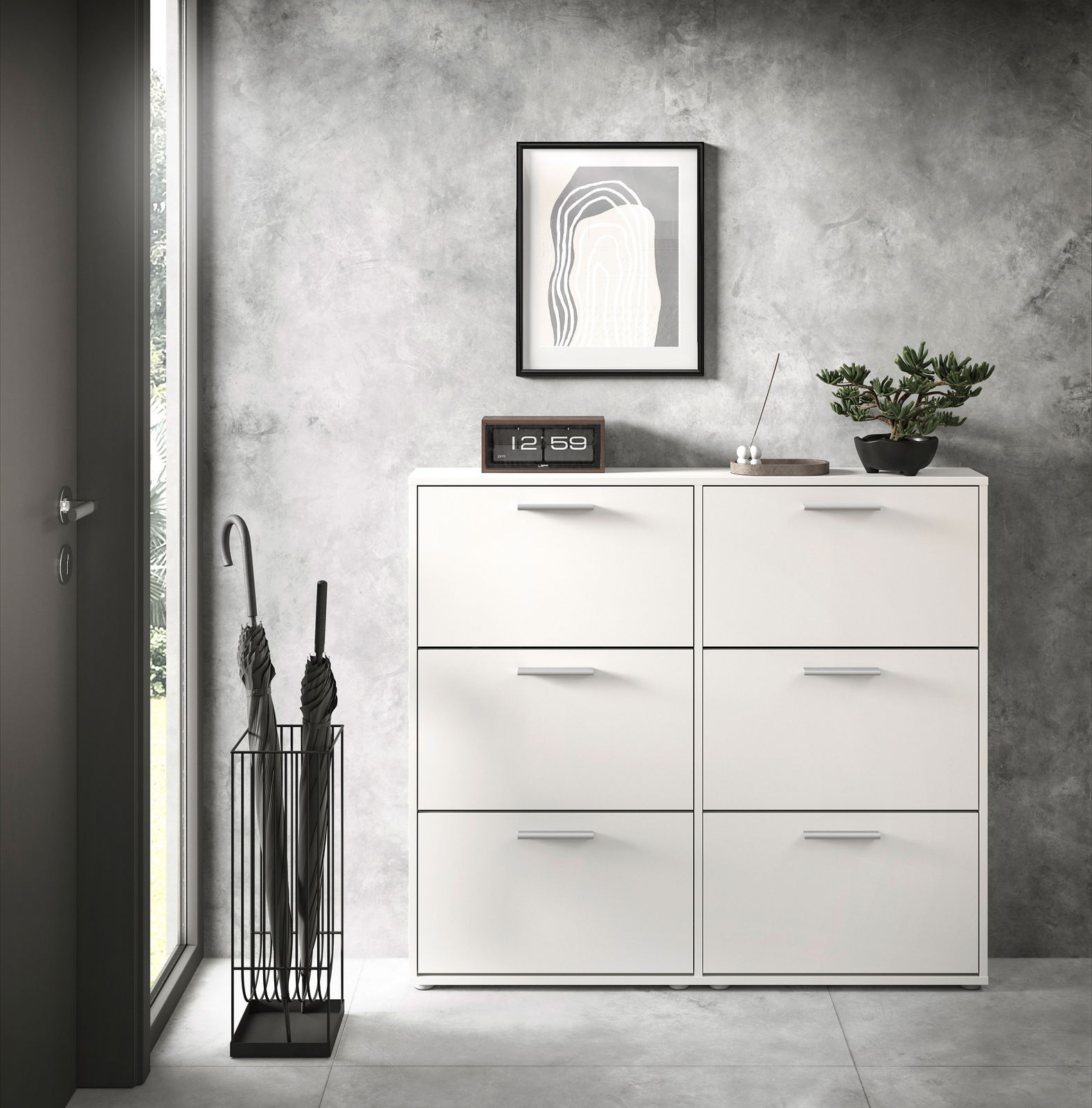 Moderner weißer Schuhkipper mit sechs Fächern, frontal fotografiert, in einem stilvollen Eingangsbereich mit grauer Wand, dekoriert mit einer Pflanze, einer Uhr und einem Kunstwerk.