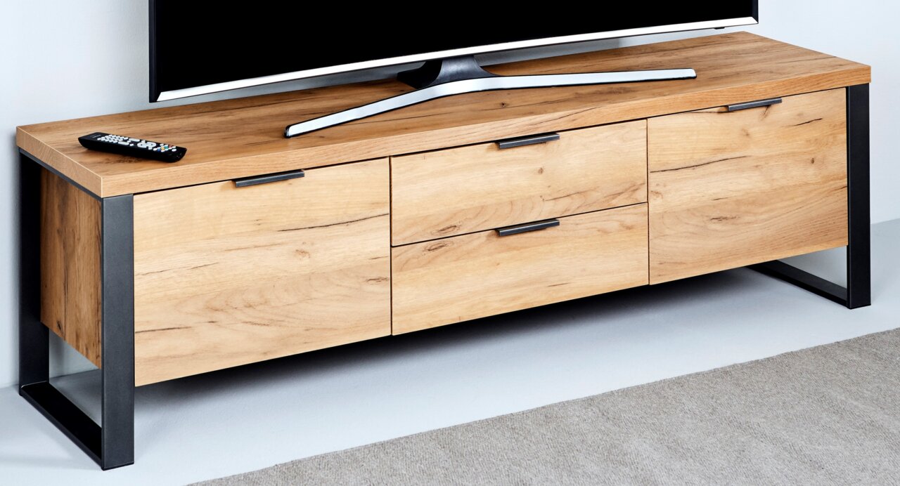 Houten tv-lowboard met drie lades en metalen frame, zijaanzicht