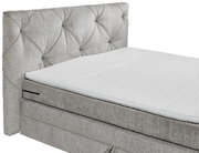Boxspringbett mit gepolstertem Kopfteil in seitlicher Perspektive
