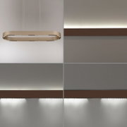 Moderne ovale LED-Pendelleuchte in Beige/Champagner, an dünnen Seilen aufgehängt, vor heller Wand – Frontansicht leicht von unten