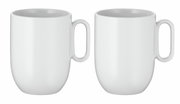 Twee witte koffiekopjes uit de WMF Barista-koffiekopjesset, die met de voorkant naar elkaar toe naast elkaar staan.
