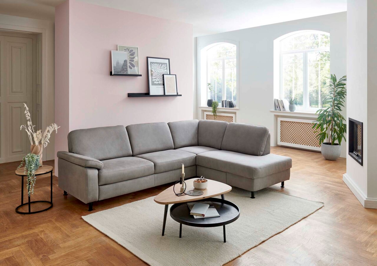 Beldomo System Ecksofa ROSTOCK Graue Polsterrundecke in modernem Wohnzimmer, seitliche Perspektive