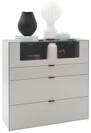 Modernes Highboard mit vier Schubladen, dekoriert mit Vasen und Büchern, seitliche Perspektive