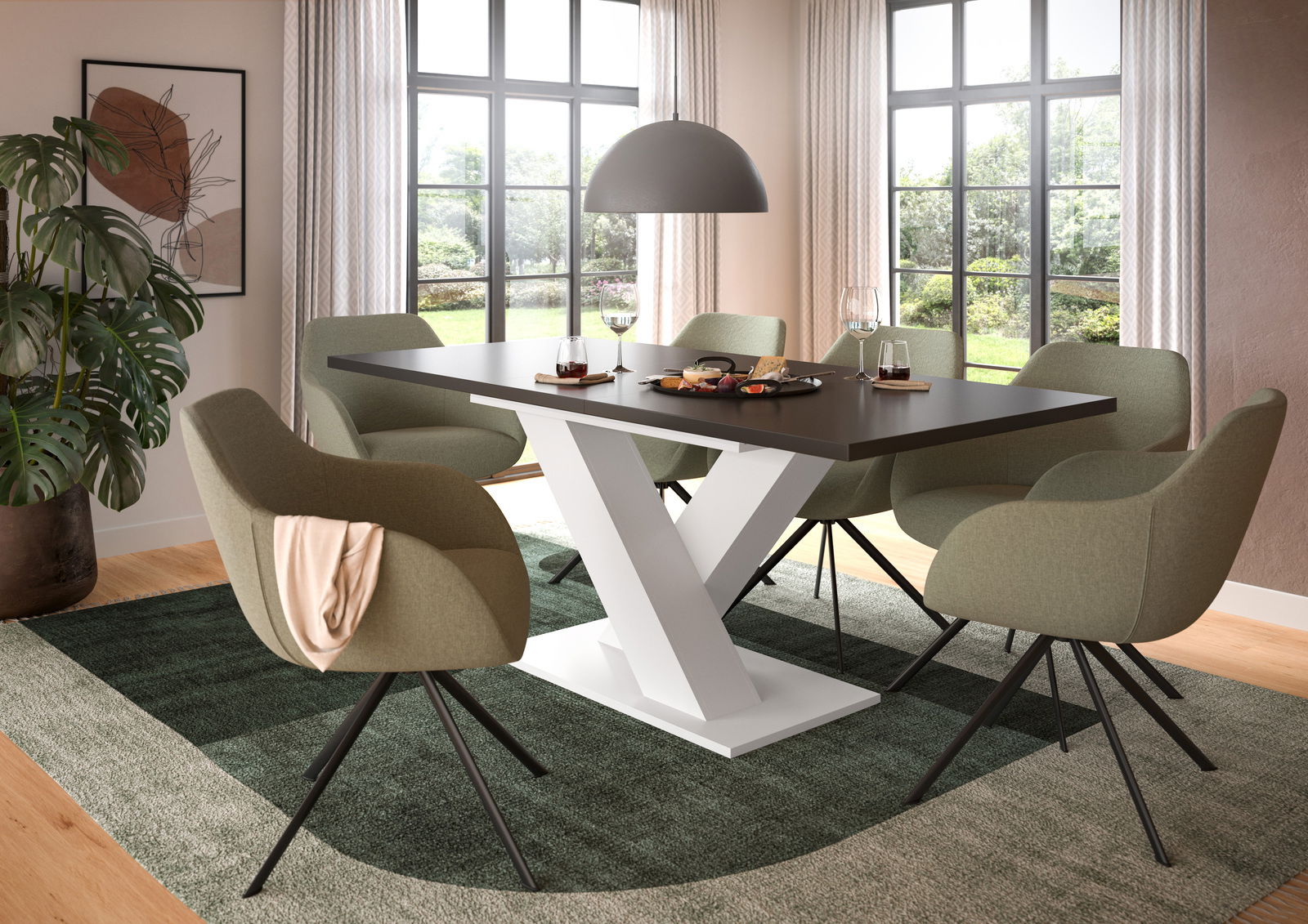 Moderner Esstisch mit Y-förmigem weißen Gestell und dunkler Tischplatte, umgeben von grünen Stühlen in einem hellen Esszimmer mit großen Fenstern, aus seitlicher Perspektive.