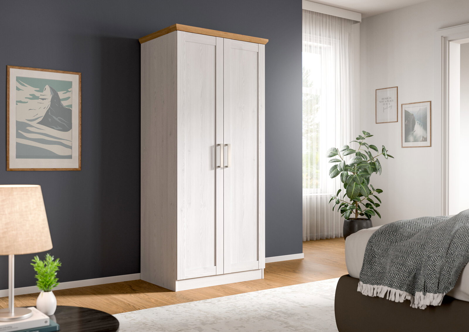 MID.YOU Kledingkast met 2 deuren FLORENCE Zweitüriger Kleiderschrank in Weiß mit Holzkranz oben und silbernen Griffen, im Schlafzimmer vor dunkelgrauer Wand, perspektivisch in leichter Frontansicht von links.