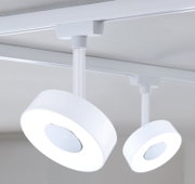 Moderner weißer Schienenspot Circle aus der Perspektive von unten, montiert an einer Decke.