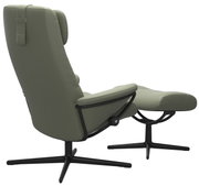 Groene fauteuil met bijzetkruk, zijaanzicht