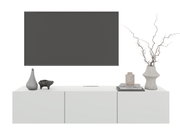 Modern hangend tv-meubel in wit met decoraties, gezien vanaf de voorkant