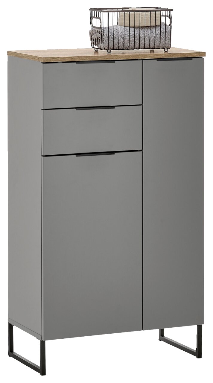 Graues Highboard mit zwei Schubladen und einer Tür, darauf ein Metallkorb mit Handtüchern, seitliche Perspektive