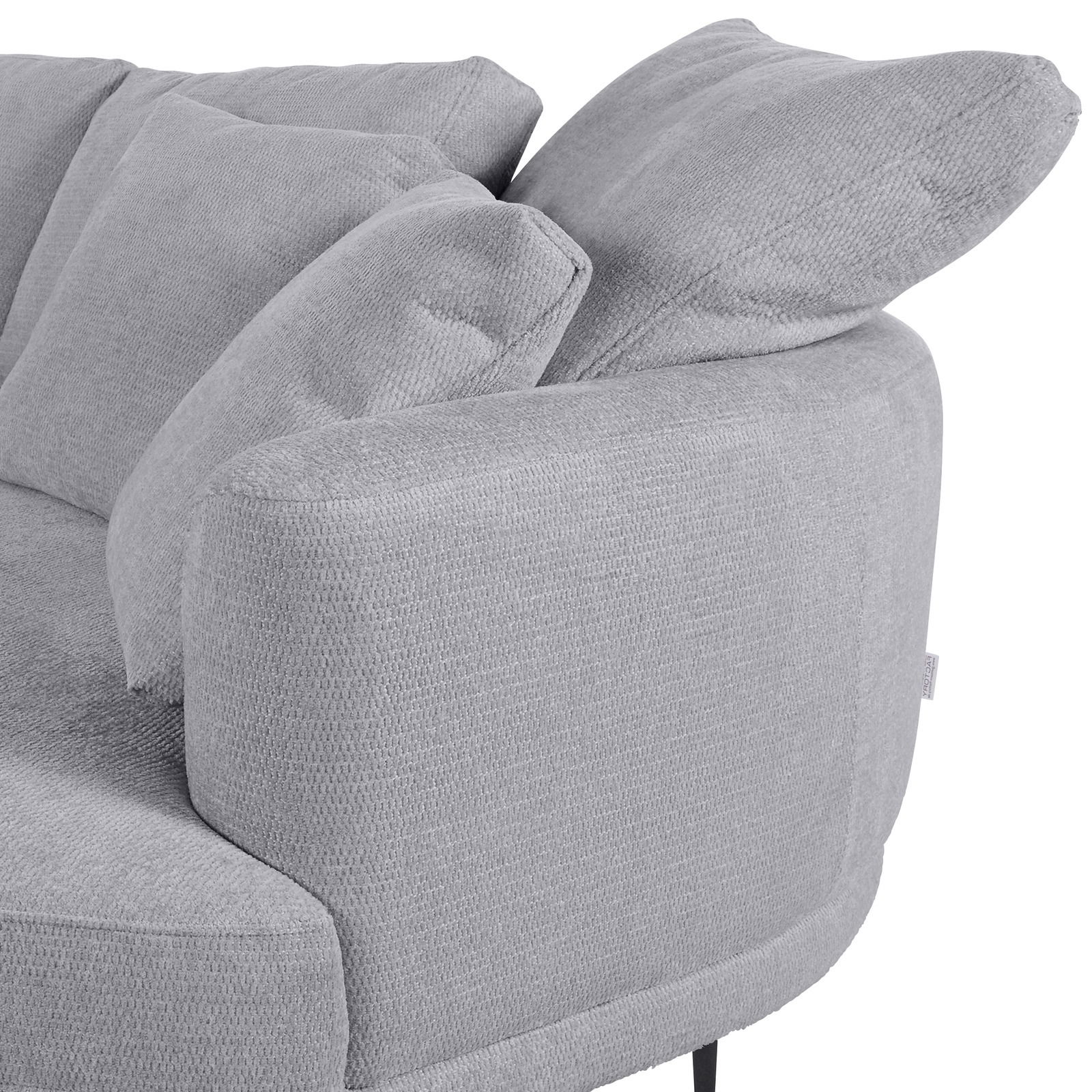 Graues Sofa mit runder Ecke und Ottomane rechts, seitliche Perspektive