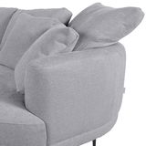 Graues Sofa mit runder Ecke und Ottomane rechts, seitliche Perspektive