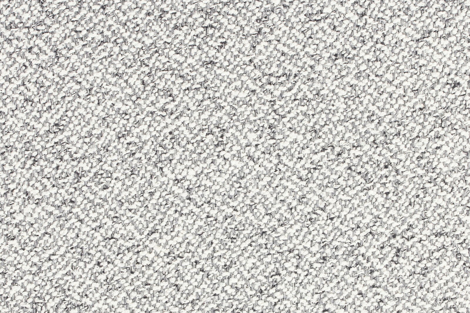 Nahaufnahme der grauen, strukturierten Stoffoberfläche des Hockers MILOU.