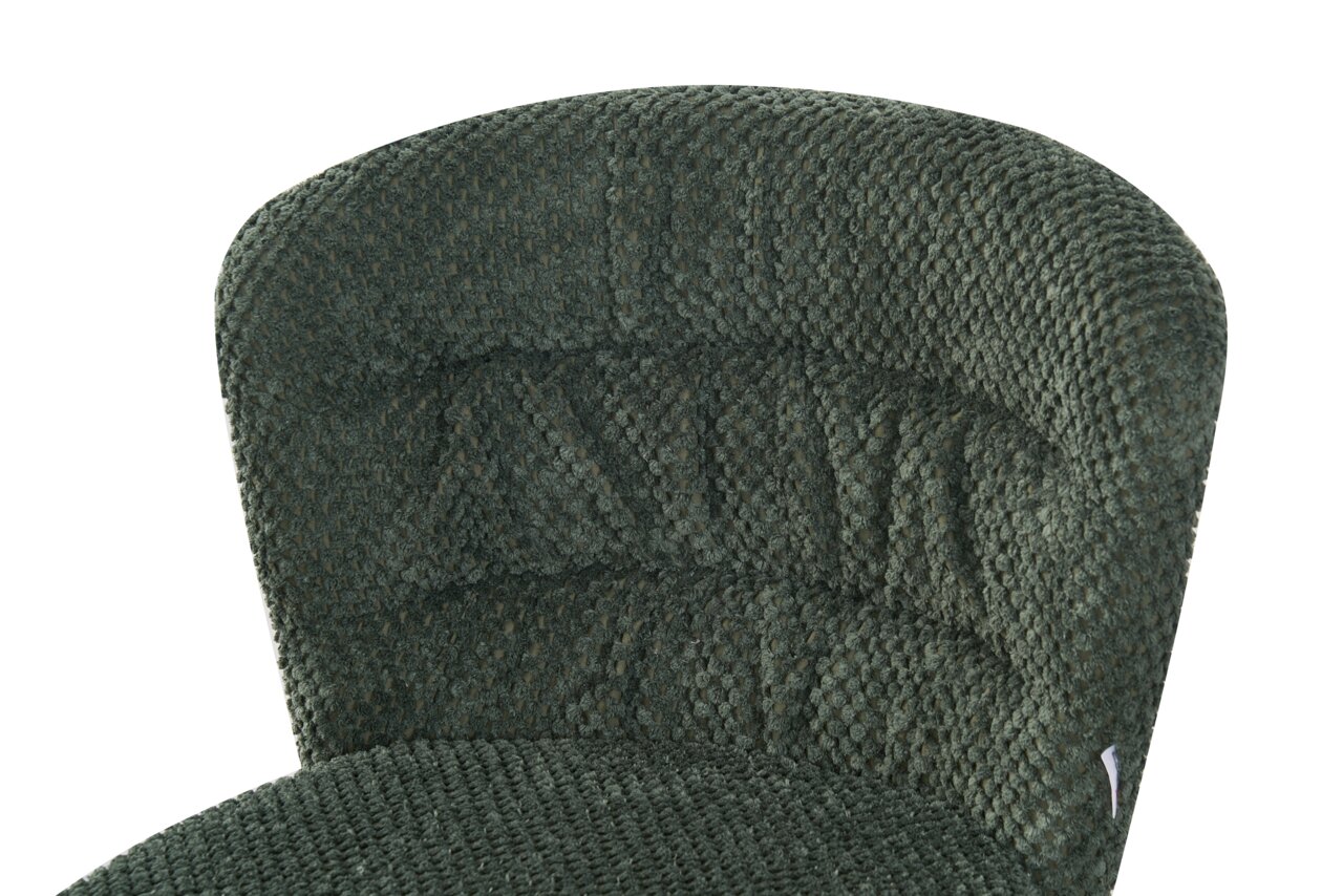 Close-up van een groene, gestructureerde stoelzitting en rugleuning, gezien vanuit vogelperspectief.