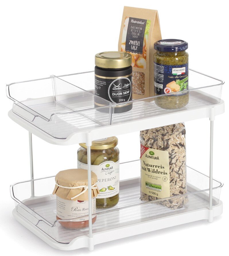 Zweistöckiges Etagenregal aus weißem Metall mit transparenten Seiten, gefüllt mit verschiedenen Lebensmitteln in Gläsern und Verpackungen, seitliche Perspektive.