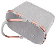 Grauer Einkaufskorb mit roségoldenem Rahmen, von oben betrachtet.