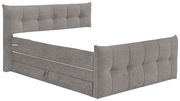 Graues Boxspringbett mit gepolstertem Kopf- und Fußteil, seitliche Perspektive