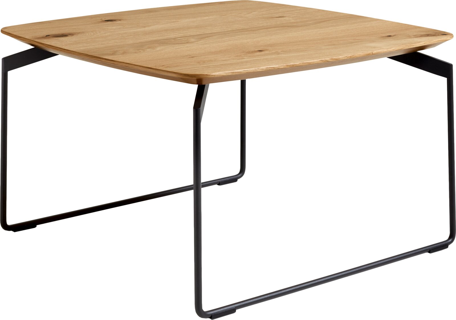 Rechthoekige eettafel met licht houten blad en zwart metalen sledeframe, schuin van voren gefotografeerd