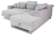 Graues Ecksofa mit verstellbaren Kopfstützen und mehreren Kissen, Perspektive von vorne rechts
