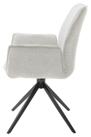 Seitenansicht eines modernen Armlehnstuhls mit hellem Stoffbezug und schwarzem Metallgestell.