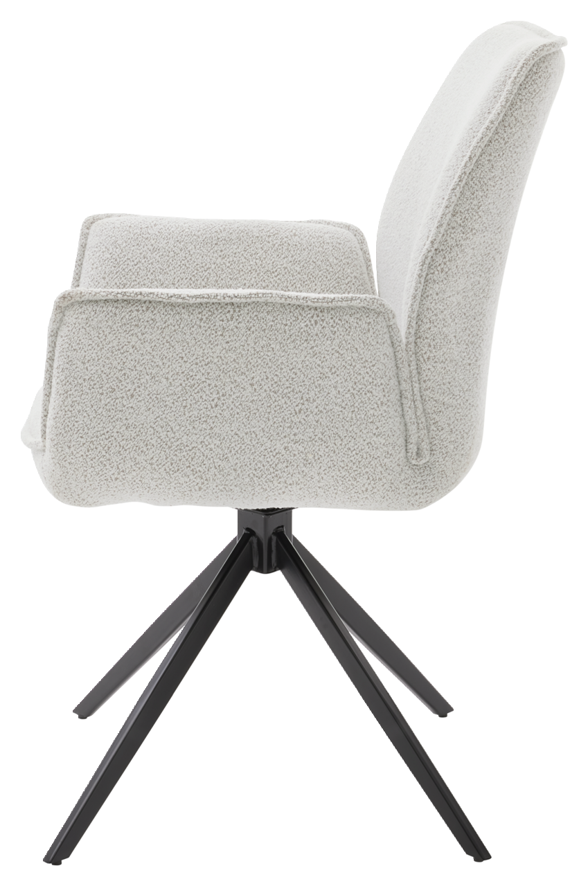 Seitenansicht eines modernen Armlehnstuhls mit hellem Stoffbezug und schwarzem Metallgestell.