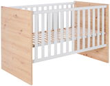 Babybett aus Holz mit weißen Gitterstäben, seitliche Perspektive