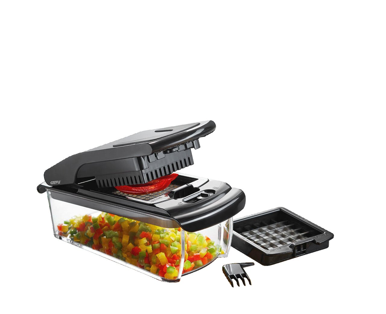 Würfel- und Stifteschneider Treppo in einer modernen Küche, seitliche Perspektive, umgeben von geschnittenem Gemüse und Obst.