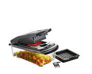 Würfel- und Stifteschneider Treppo in einer modernen Küche, seitliche Perspektive, umgeben von geschnittenem Gemüse und Obst.