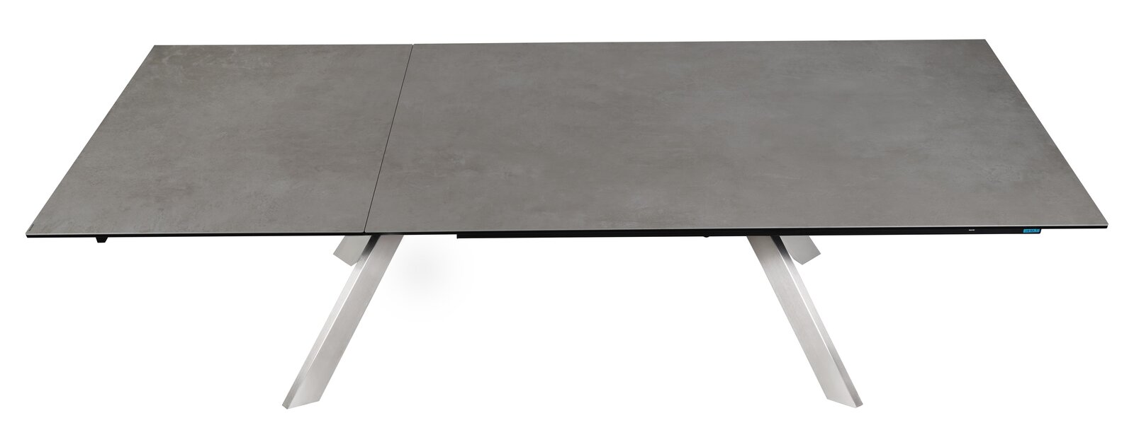 Moderner Esstisch mit grauer Tischplatte und schrägen Metallbeinen, Ansicht von oben.