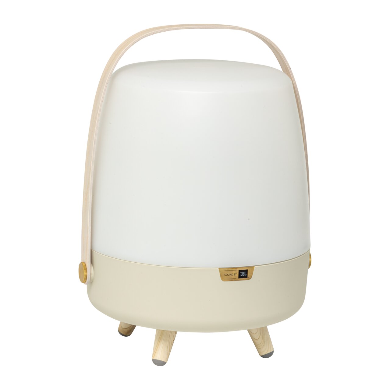 Tragbare Lampe mit integriertem JBL-Lautsprecher, sandfarben, auf drei Beinen stehend, mit Tragegriff, Frontalansicht.