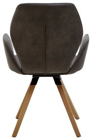 Rückansicht eines Armlehnenstuhls mit dunklem Polster und Holzbeinen