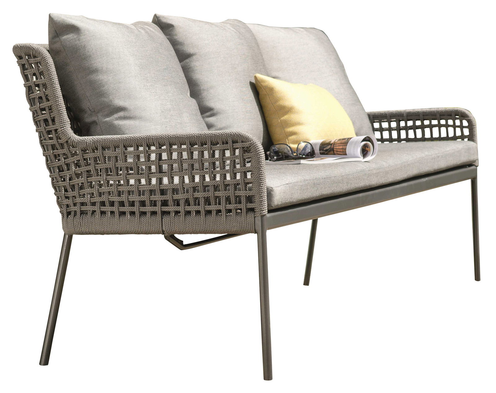 Stern Dining Bank GRETA Seitliche Ansicht einer modernen Dining Bank mit grauem Geflecht und Kissen, dekoriert mit einem gelben Kissen und einer Zeitschrift.