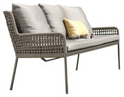 Seitliche Ansicht einer modernen Dining Bank mit grauem Geflecht und Kissen, dekoriert mit einem gelben Kissen und einer Zeitschrift.