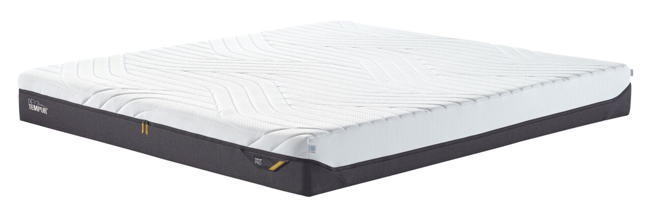 Viscomatratze 180x200 medium in seitlicher Perspektive, mit weißem Obermaterial und dunklem Unterteil.