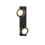 Schwarze, moderne LED-Wandleuchte mit zwei runden Lichtköpfen auf länglicher Montageplatte, warmweiß leuchtend, Produktansicht von vorne auf weißem Hintergrund