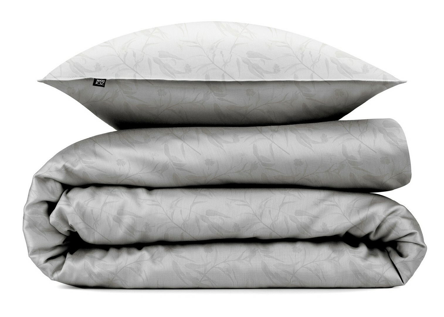 Stapel aus Bettwäsche-Set in Grau mit floralem Muster, bestehend aus einem Kissenbezug und einem gefalteten Bettbezug, frontal betrachtet.