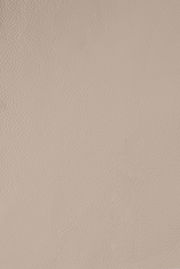 Nahaufnahme einer beigen Lederstruktur, von oben betrachtet.