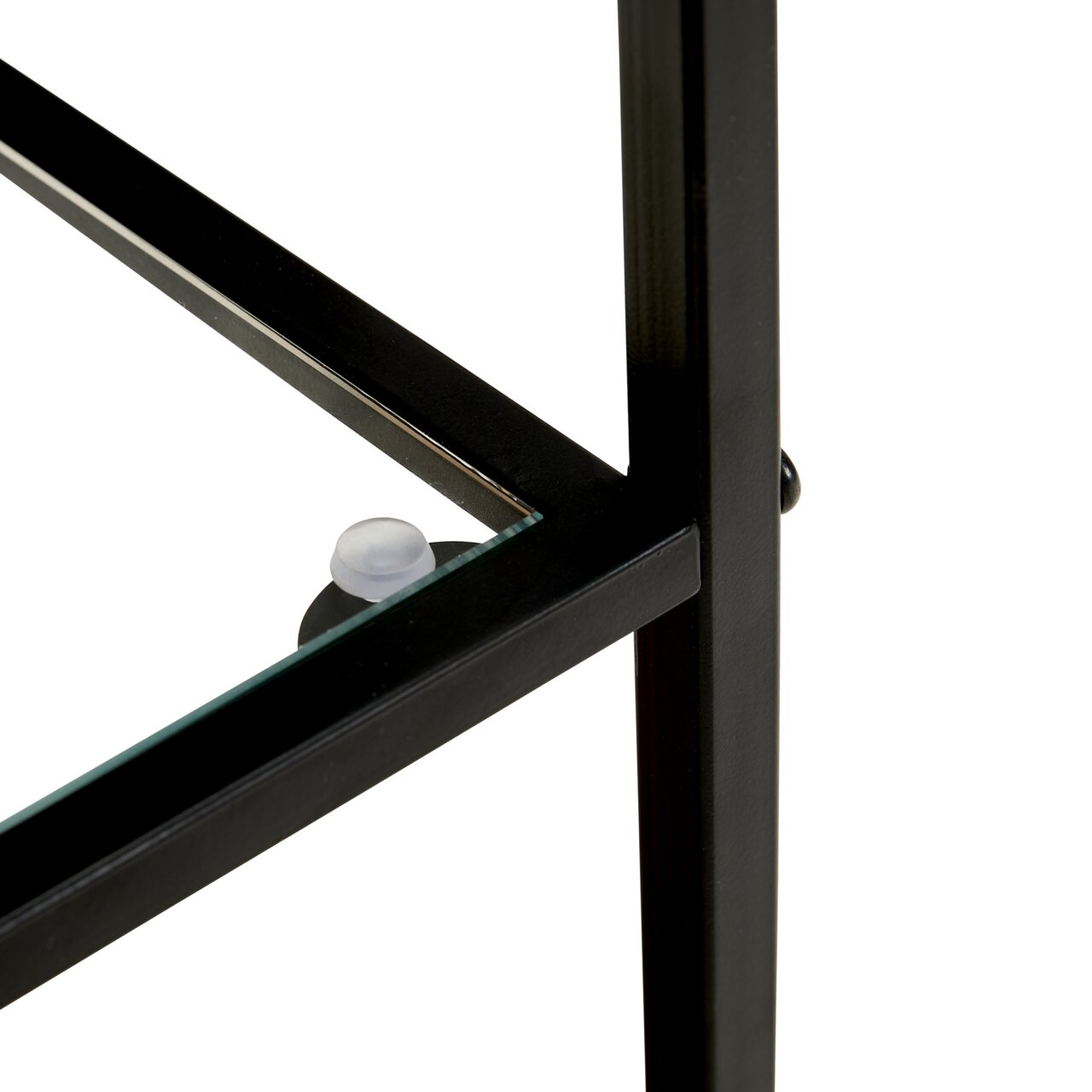 Detailfoto vanuit een schuin zijaanzicht: zwart metalen frame met glazen bodem, glazen blad met doorzichtige afstandhouder
