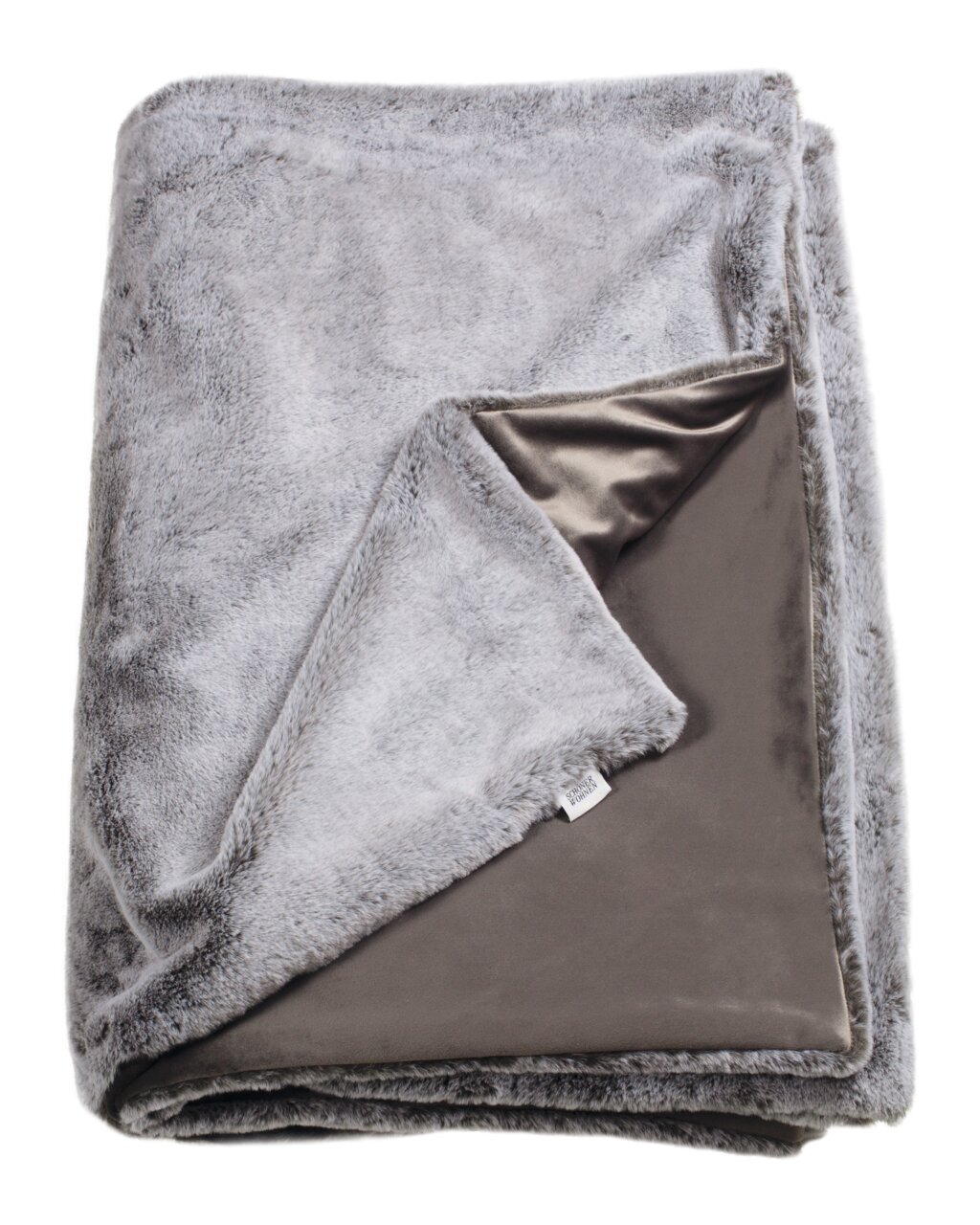 Graues, flauschiges Plaid mit samtiger Innenseite, teilweise umgeschlagen, aus der Vogelperspektive fotografiert.