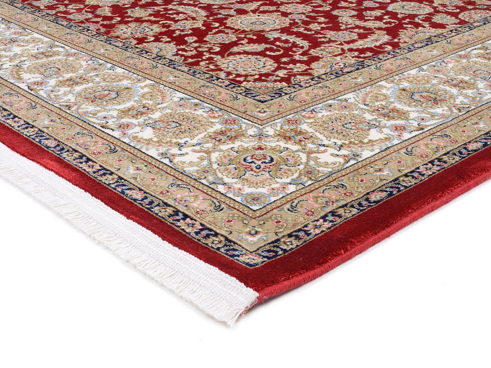 Detailansicht eines Orientteppichs mit rotem Hintergrund und komplexen floralen Mustern in Beige, Weiß und Blau. Die Perspektive zeigt eine Ecke des Teppichs mit Fransen.