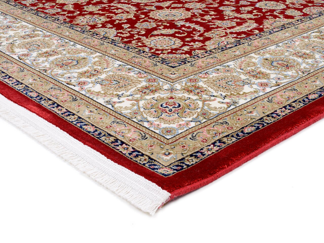 Detailansicht eines Orientteppichs mit rotem Hintergrund und komplexen floralen Mustern in Beige, Weiß und Blau. Die Perspektive zeigt eine Ecke des Teppichs mit Fransen.