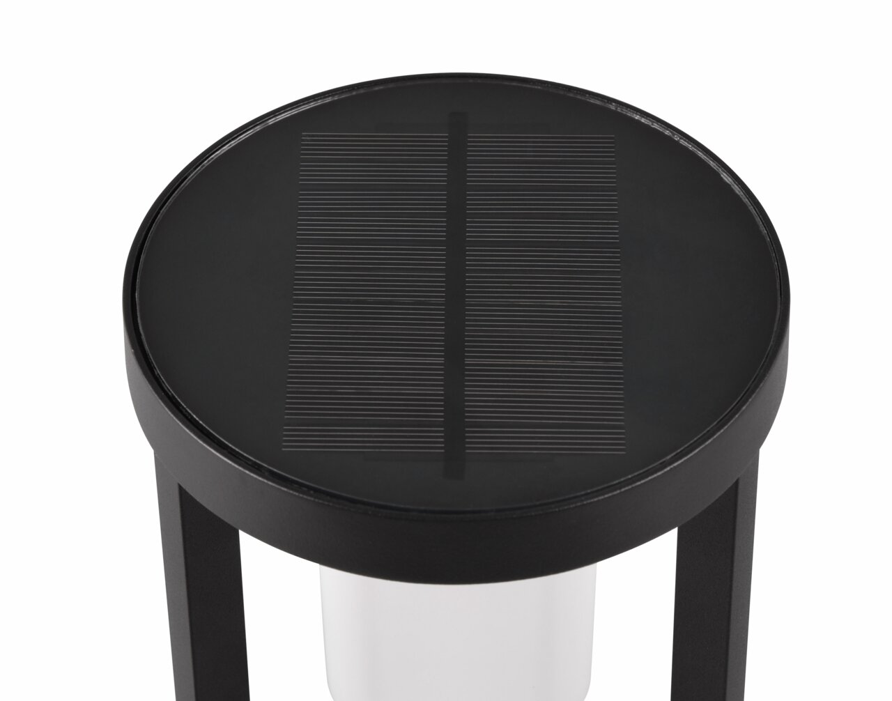 Runde schwarze Solarlampe von oben betrachtet mit Glasabdeckung und sichtbarem Solarpanel.
