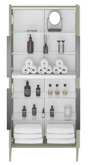 Frontansicht eines Midischranks mit Glastüren, gefüllt mit Handtüchern, Pflegeprodukten und einem Spiegel.