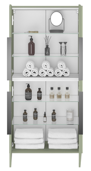 Frontansicht eines Midischranks mit Glastüren, gefüllt mit Handtüchern, Pflegeprodukten und einem Spiegel.