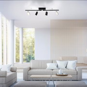 Moderne Deckenleuchte PURE MIRA von Paul Neuhaus in einem stilvollen Wohnzimmer, Perspektive von unten.