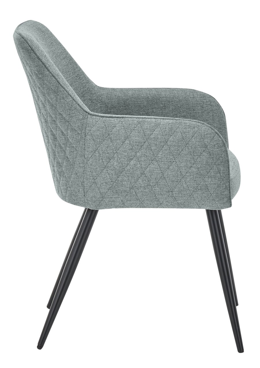 Seitenansicht eines grauen Armlehnstuhls mit schwarzen Metallbeinen und gestepptem Stoffbezug.