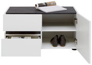 Weiße Bank mit schwarzer Oberfläche, zwei offenen Schubladen und einem offenen Fach mit Schuhen, aus frontaler Perspektive.