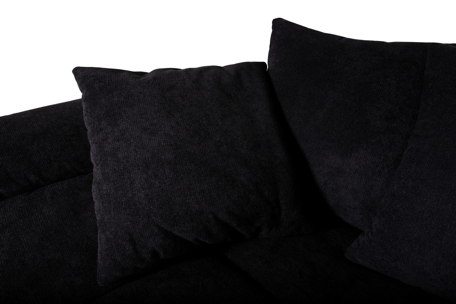 Nahaufnahme einer schwarzen Rundecke mit weichen Kissen, von oben betrachtet.